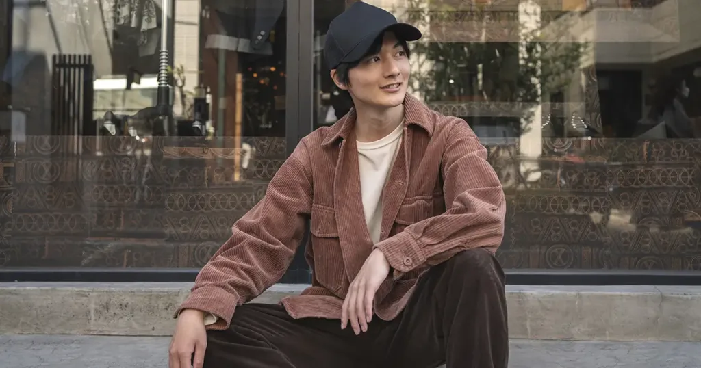 Muted Korean menswear cardigan and desert boots style in Seongsu